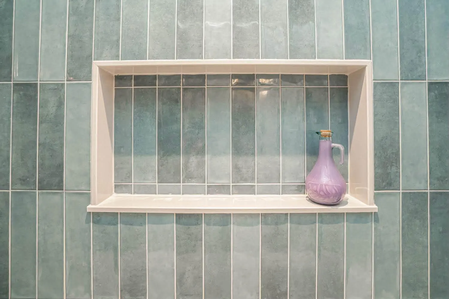 Sea-green stacked shower, framed niche