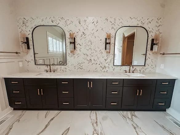 Double vanity, marble herringbone wall